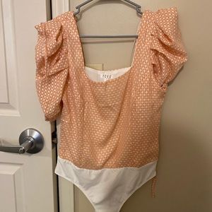 Cute puff sleeve body suit! Never worn but doesn’t have the tag on